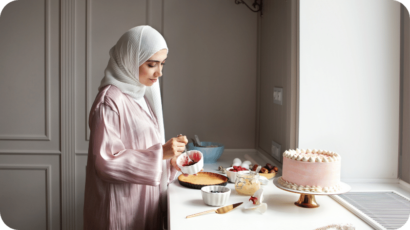 Modestly dressed woman making a cake