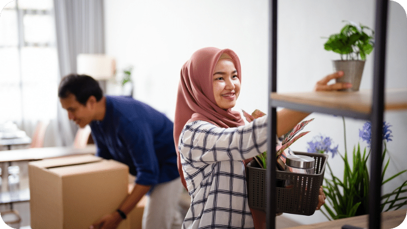 young muslim couple unpacking in their new home