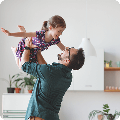 Man holding up his child