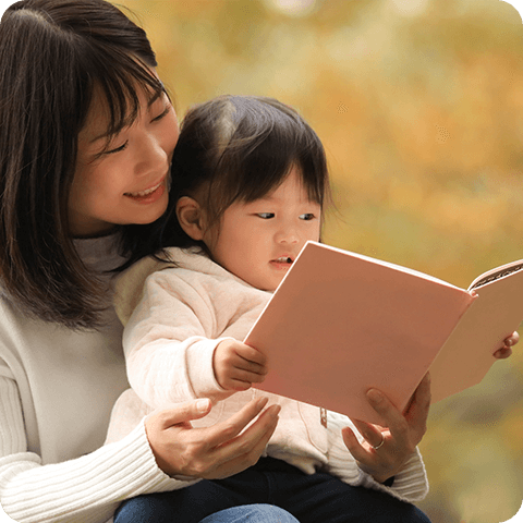 Young mother reading to her daughter